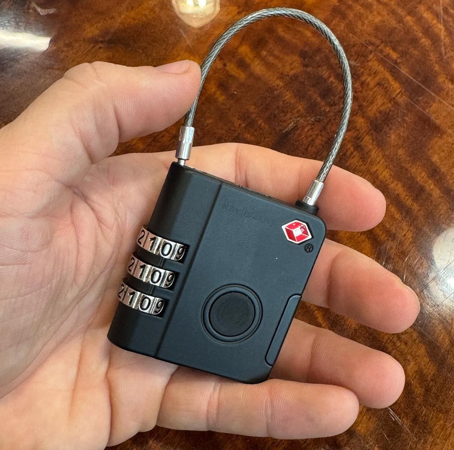 Close-up of the SmartLock TSA-approved combination luggage lock held in a hand