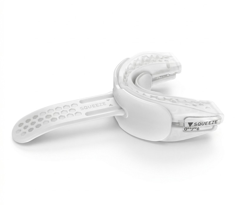 The SnoreRX mouthpiece showing its SQUEEZE calibrator and millimeter markings
