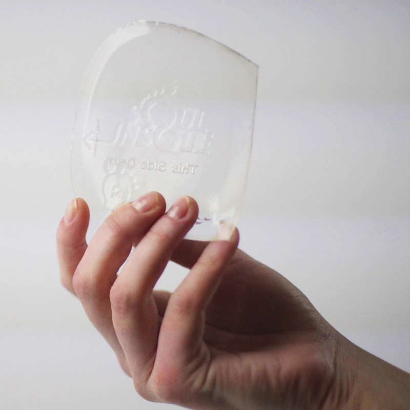 Clear Soul Insole medical-grade gel orthotic held in a hand