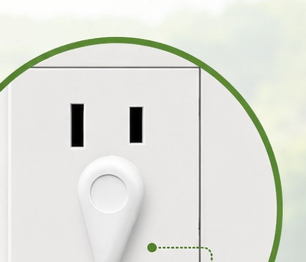 Terra grounding cord plugged into the ground pin of a three-prong wall outlet