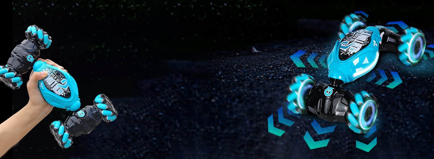 A hand holding the Orbi RC Car beside it drifting on gravel