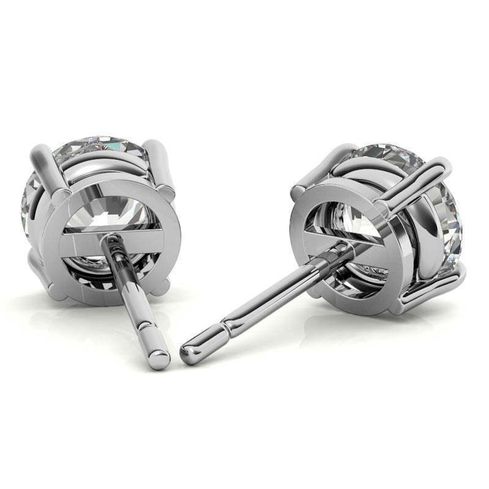 Close-up of a Voss+Agin lab-grown diamond stud showing the four-prong basket setting and post