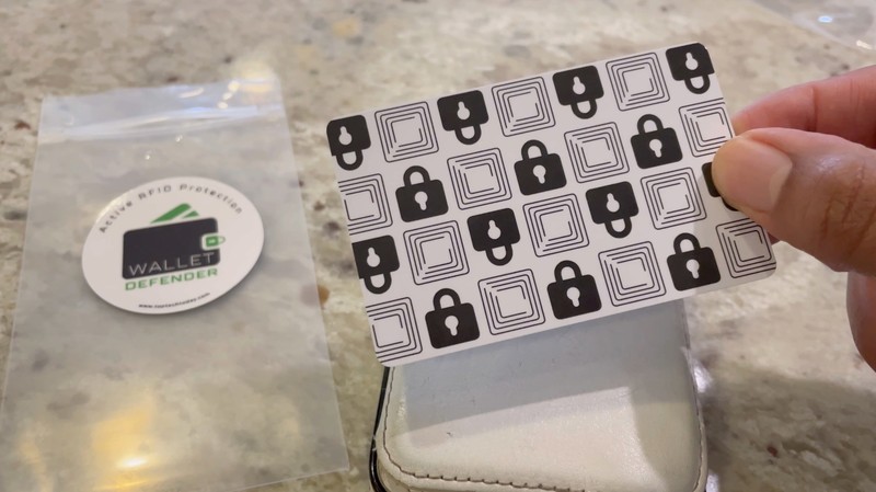 The Wallet Defender RFID-blocking card with its packaging pouch