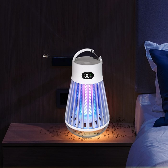 Zappify portable bug zapper glowing on a bedroom nightstand with insects gathered below