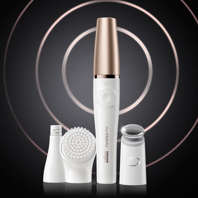 Braun FaceSpa Pro 911 facial epilator shown with its attachment heads