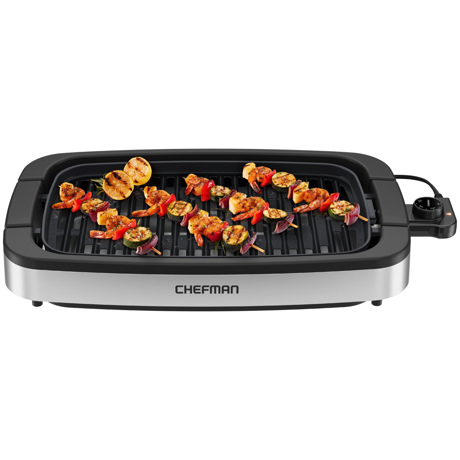 Chefman electric smokeless indoor grill with food cooking on the ridged grate