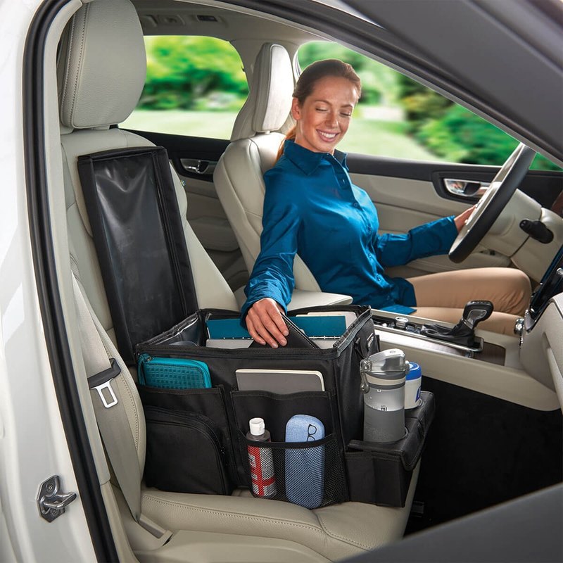 High Road CarHop seat organizer and cooler sitting on a car's front passenger seat holding files and a water bottle
