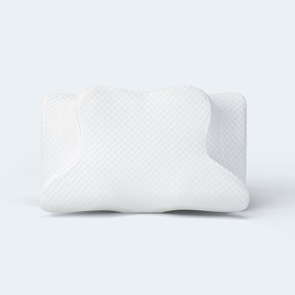 The white Zamat butterfly cervical pillow showing its winged contour shape